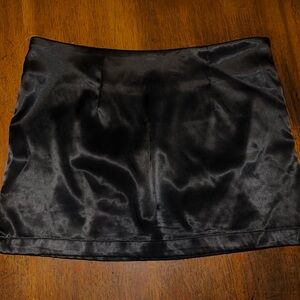 Black satin mini skirt